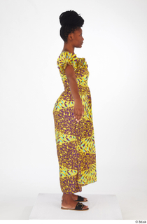 Dina Moses A poses dressed standing whole body yellow long…